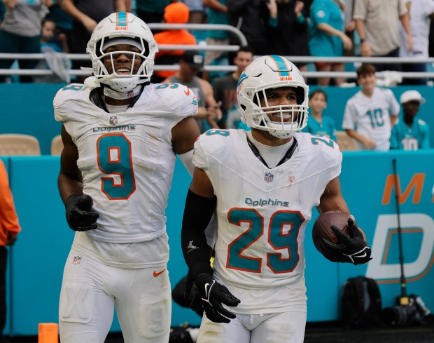 Miami Dolphins safety Ifeatu Melifonwu (9) and Miami Dolphins safety...