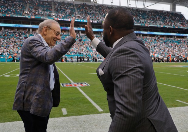 Miami Dolphins owner Stephen Ross and GM Champ Kelly celebrate...