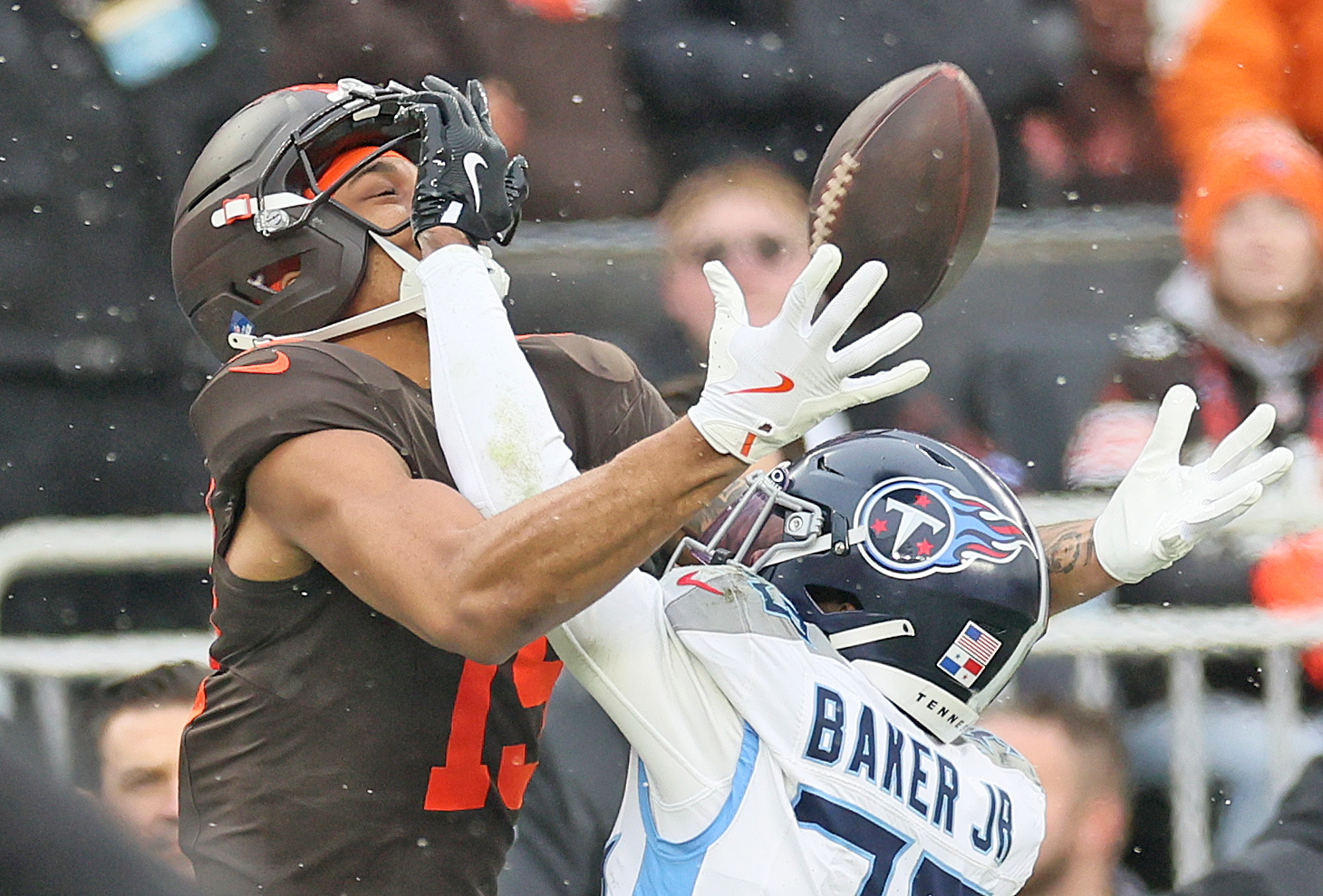 Cleveland Browns wide receiver Cedric Tillman leaps up for a high pass defended by Tennessee Titans cornerback Darrell Baker Jr. that went incomplete in the first half at Huntington Bank Field.
