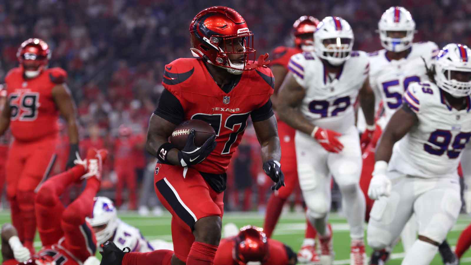 Houston Texans running back Woody Marks (27) runs against the Buffalo Bills in the first quarter at NRG Stadium.