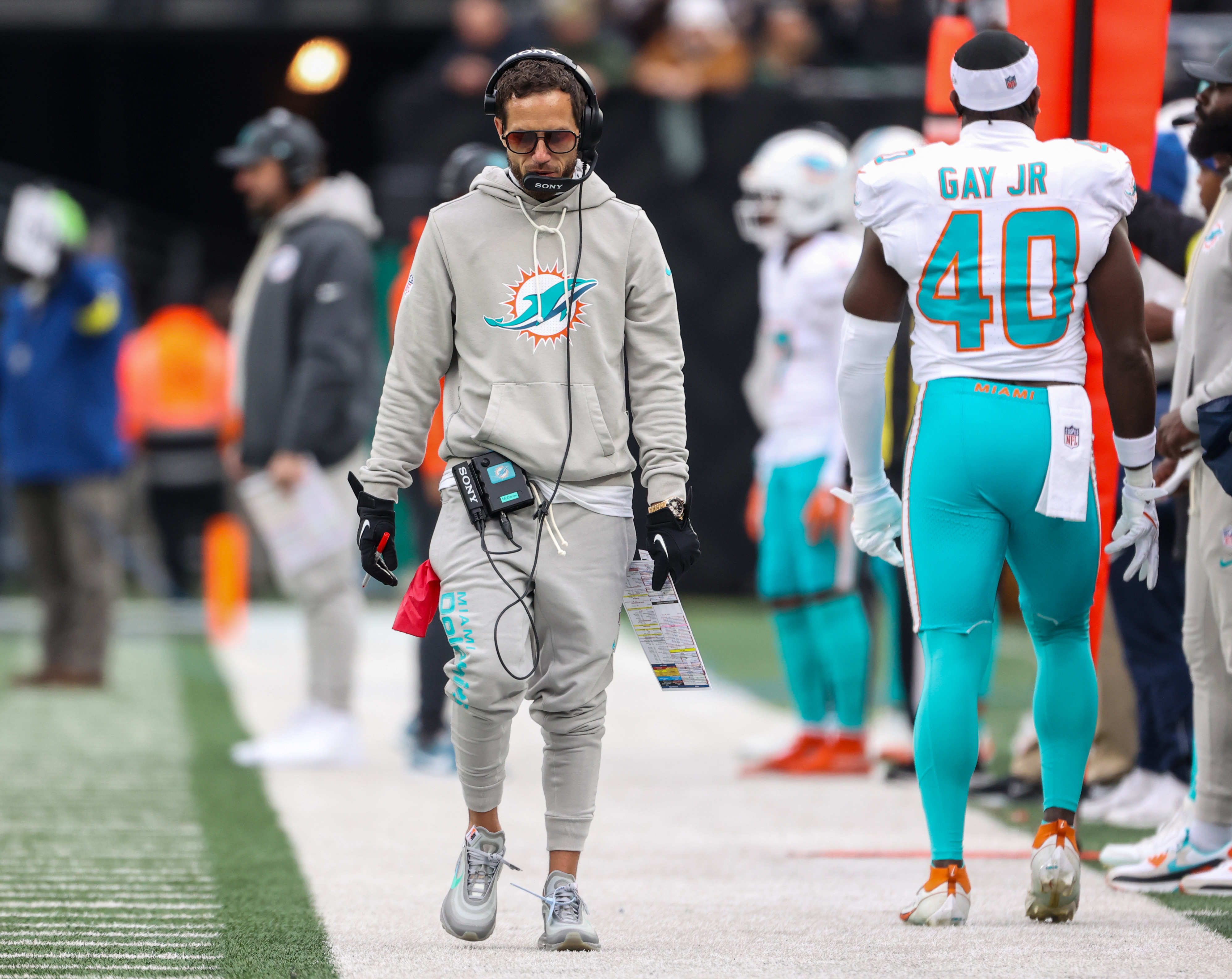 Miami Dolphins head coach Mike McDaniel walks by linebacker Willie Gay Jr. (40) during the first quarter against the New York Jets, Sunday, Dec. 7, 2025 at MetLife Stadium in East Rutherford, N.J.