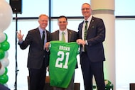 North Texas NCAA head football coach Neal Brown, center, is introduced as the 21st coach by...