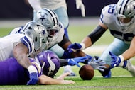 Dallas Cowboys defensive end Dorance Armstrong (second from left) pounces on a fumble by...