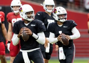 Aug 2, 2025; Glendale, AZ, USA; Arizona Cardinals quarterback Kyler Murray (1) and Jacoby Brissett (7) during the Red and White practice in training camp at State Farm Stadium. Mandatory Credit: Mark J. Rebilas-Imagn Images
