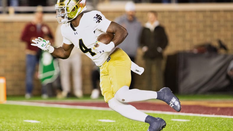 Jeremiyah Love runs for a long touchdown against Boston College. vikings draft curveballs 2026.