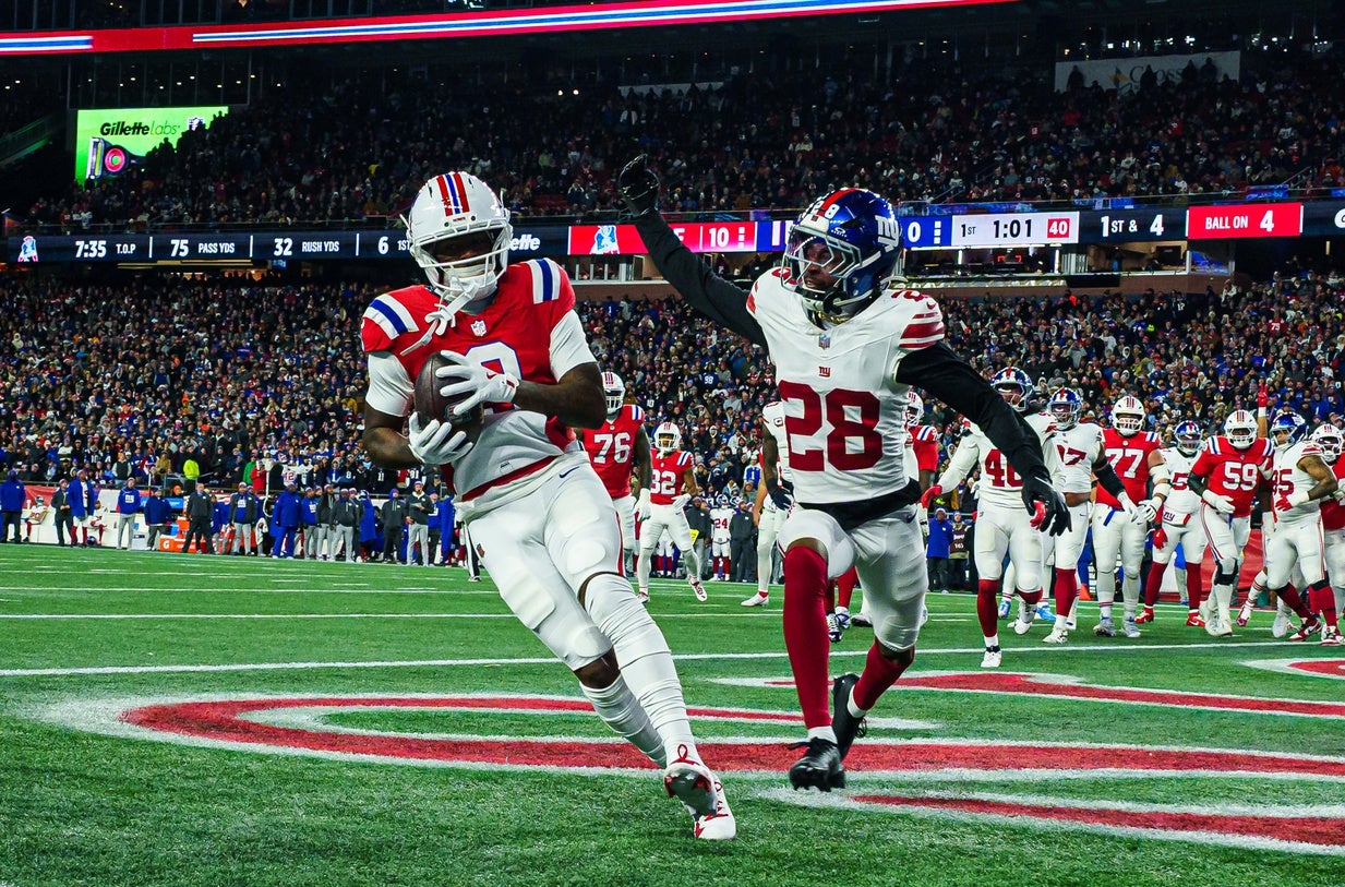 Dec 1, 2025; Foxborough, Massachusetts, USA; New England Patriots wide receiver Kayshon Boutte (9) catches a pass for a touchdown against New York Giants cornerback Cor'Dale Flott (28) during the first quarter at Gillette Stadium. Mandatory Credit: David Butler II-Imagn Images
