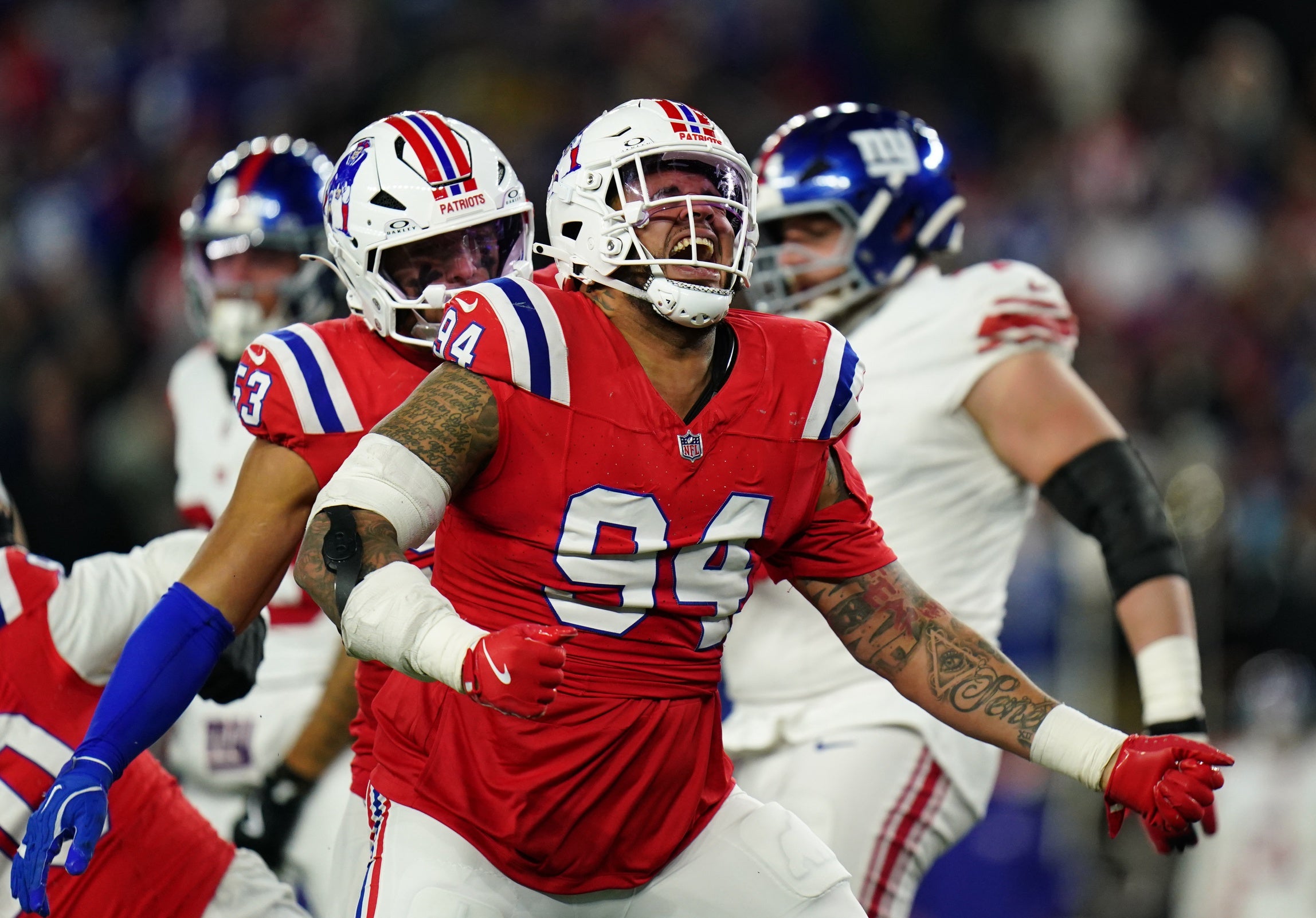 Dec 1, 2025; Foxborough, Massachusetts, USA; New England Patriots defensive tackle Cory Durden (94) celebrates after a play during the fourth quarter against the New York Giants at Gillette Stadium. Mandatory Credit: David Butler II-Imagn Images