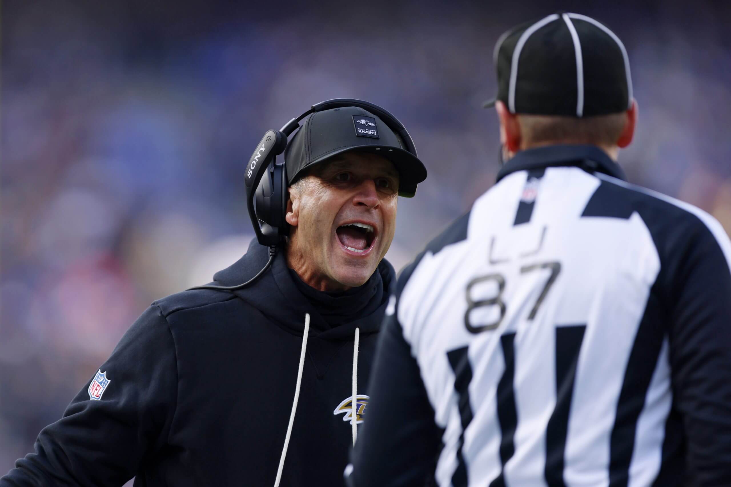 Ravens coach John Harbaugh argues with an official.