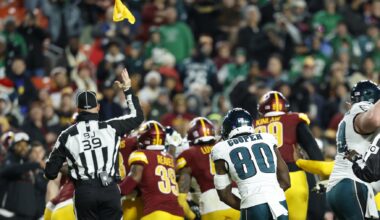 Dec 20, 2025; Landover, Maryland, USA; Back judge Rich Martinez (39) throws a flag into the air during a fight between Philadelphia Eagles and Washington Commanders players in the fourth quarter at Northwest Stadium.