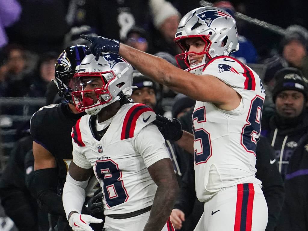 Dec 21, 2025; Baltimore, Maryland, USA; New England Patriots wide receiver Stefon Diggs (8) and New England Patriots tight end Hunter Henry (85) react during the first quarter of the game against the Baltimore Ravens at M&T Bank Stadium. Mandatory Credit: James Lang-Imagn Images