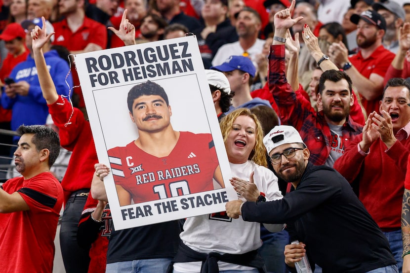 Texas Tech fans celebrate after a touchdown during the first half of the Big 12 Championship...