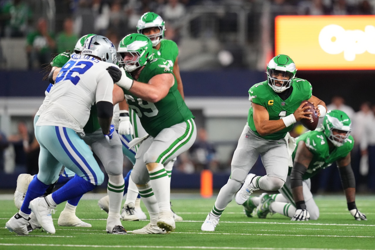 Philadelphia Eagles quarterback Jalen Hurts scrambles during an NFL game against the Dallas Cowboys on Sunday, Nov. 23, 2025, at AT&T Stadium in Arlington, Texas.