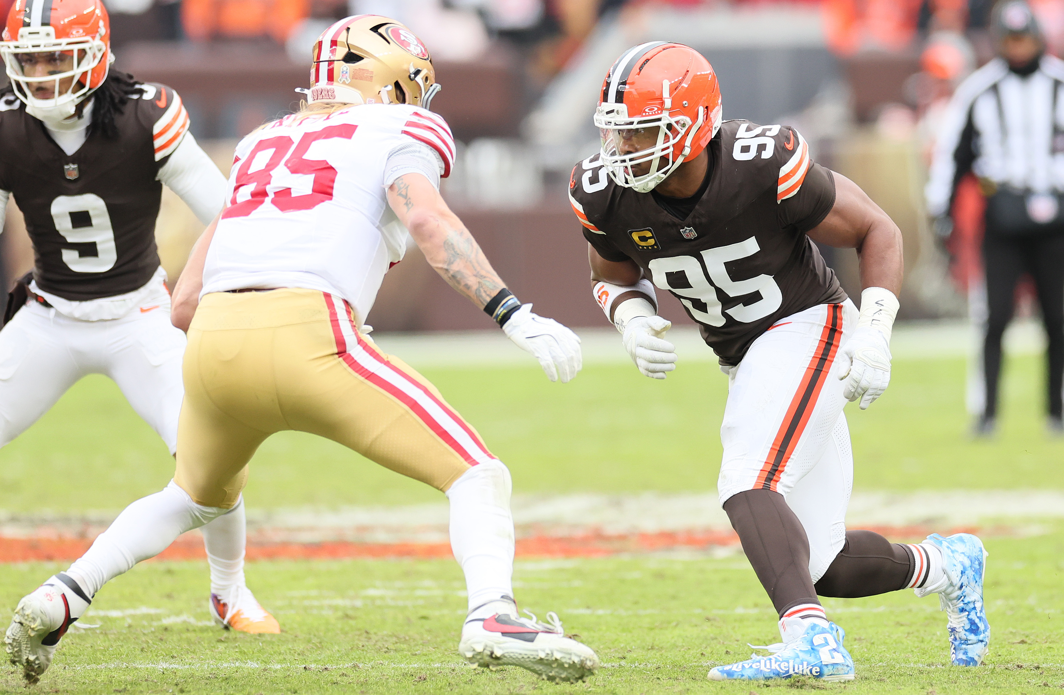 San Francisco 49ers tight end George Kittle (L) blocks Cleveland Browns defensive end Myles Garrett on a pass play in the first half at Huntington Bank Field.