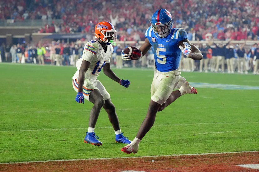 Mississippi running back Kewan Lacy (5) runs past Florida safety Jordan Castell (14) for a...