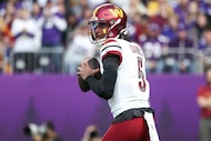 Washington Commanders quarterback Jayden Daniels (5) in action against the Minnesota Vikings...