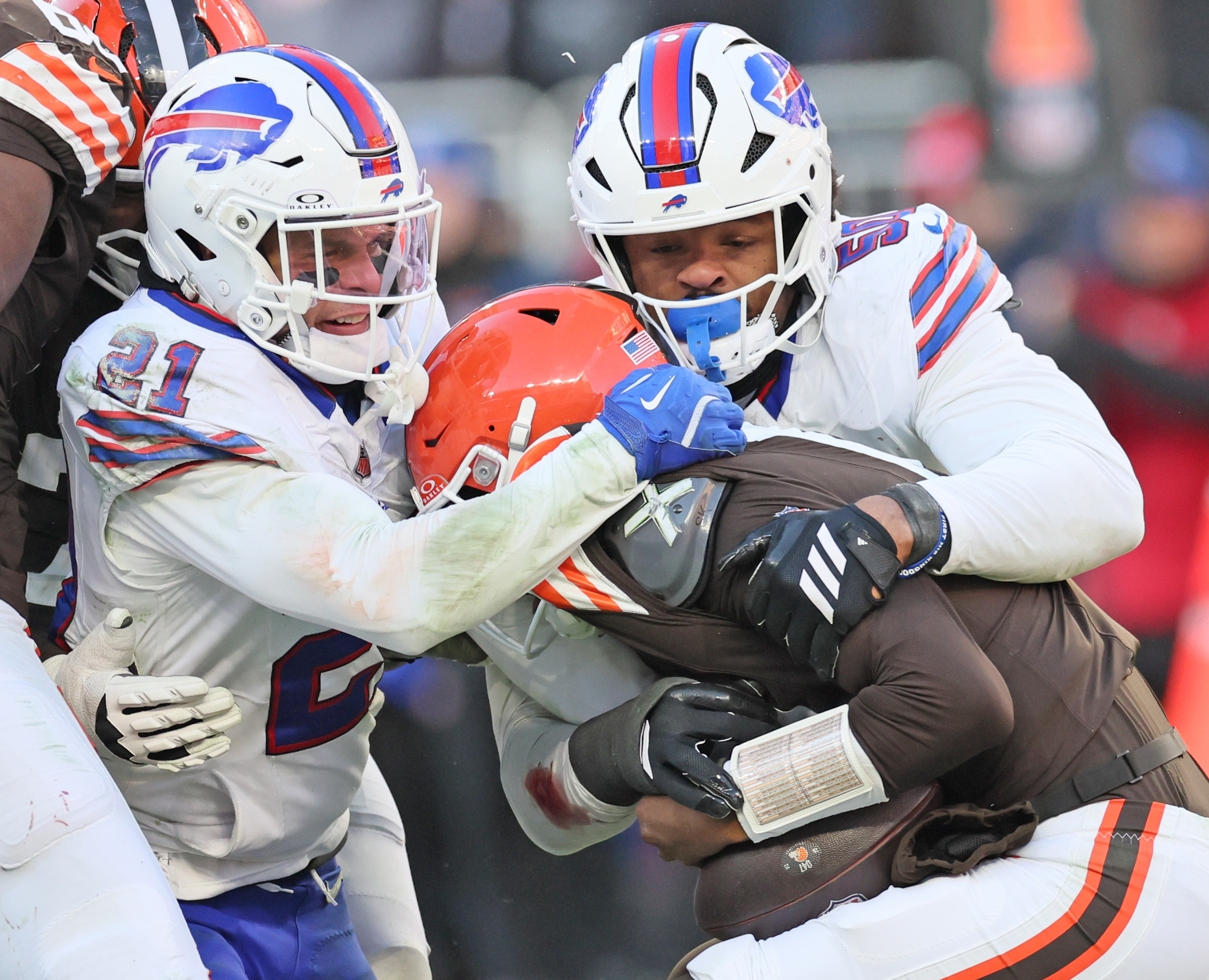 Buffalo Bills safety Jordan Poyer (L) and Buffalo Bills defensive end Greg Rousseau team up to sack Cleveland Browns quarterback Shedeur Sanders in the second half.  