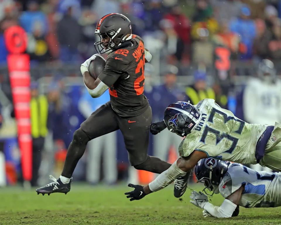 Cleveland Browns running back Dylan Sampson (22) breaks away from Tennessee Titans linebacker Cedric Gray (33) for a first down during the second half of an NFL football game at Huntington Bank Field, Dec. 7, 2025, in Cleveland, Ohio.