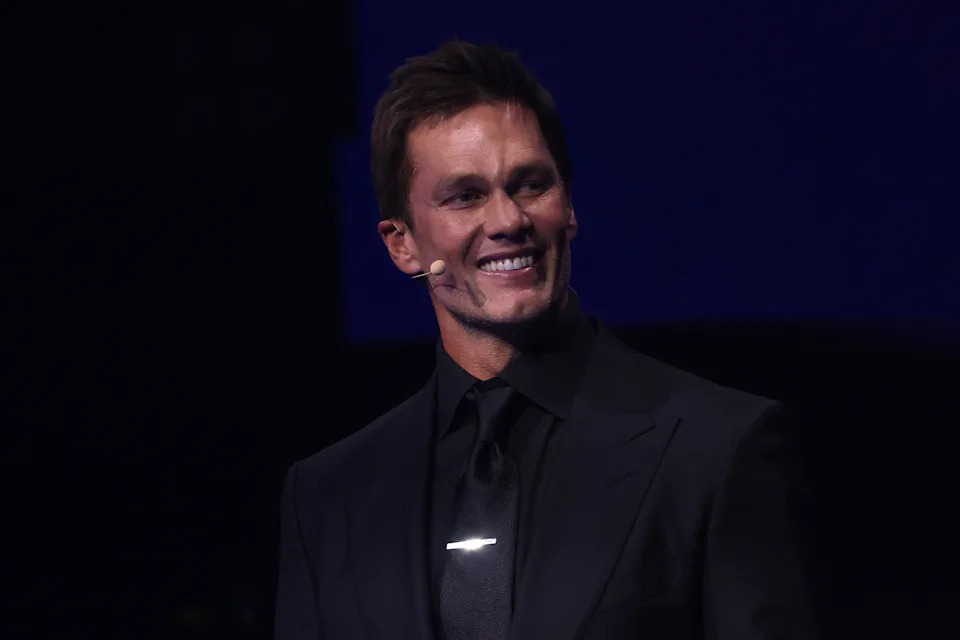 WASHINGTON, DC - DECEMBER 05: Draw assistant Tom Brady speaks on stage during the FIFA World Cup 2026 Official Draw at John F. Kennedy Center for the Performing Arts on December 05, 2025 in Washington, DC. (Photo by Patrick Smith/Getty Images)