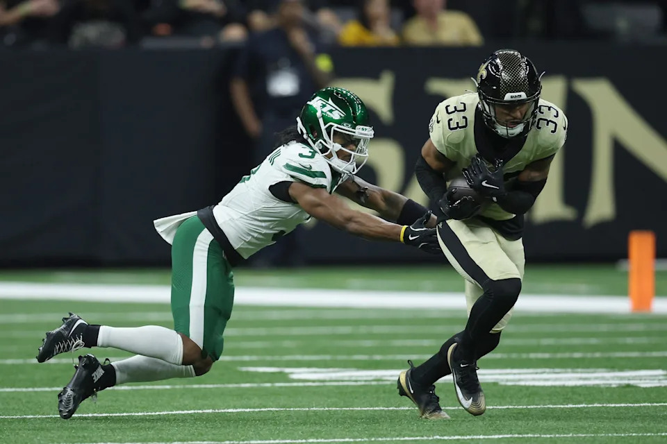 NEW ORLEANS, LOUISIANA - DECEMBER 21: Jonas Sanker #33 of the New Orleans Saints intercepts a pass intended for John Metchie III #3 of the New York Jets in the fourth quarter of a game at Caesars Superdome on December 21, 2025 in New Orleans, Louisiana. (Photo by Chris Graythen/Getty Images)