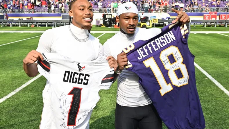 Sep 22, 2024; Minneapolis, Minnesota, USA; Minnesota Vikings wide receiver Justin Jefferson (18) and Houston Texans wide receiver Stefon Diggs (1) exchange jerseys after the game at U.S. Bank Stadium. Mandatory Credit: Jeffrey Becker-Imagn Images.