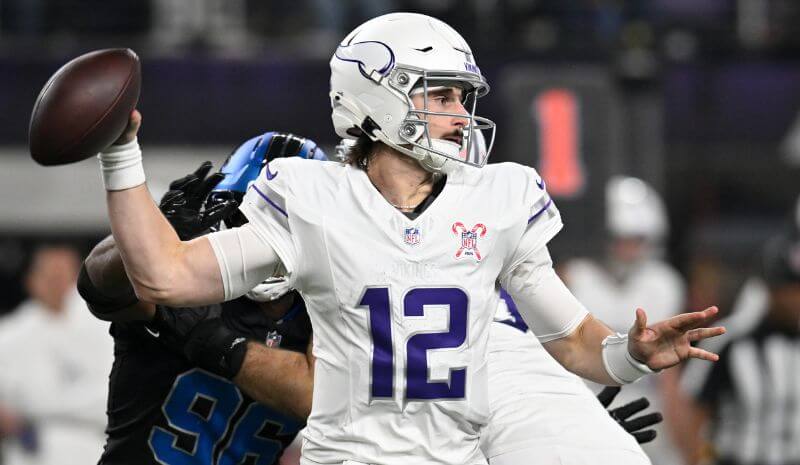 Minnesota Vikings quarterback Max Brosmer (12) passes the ball.