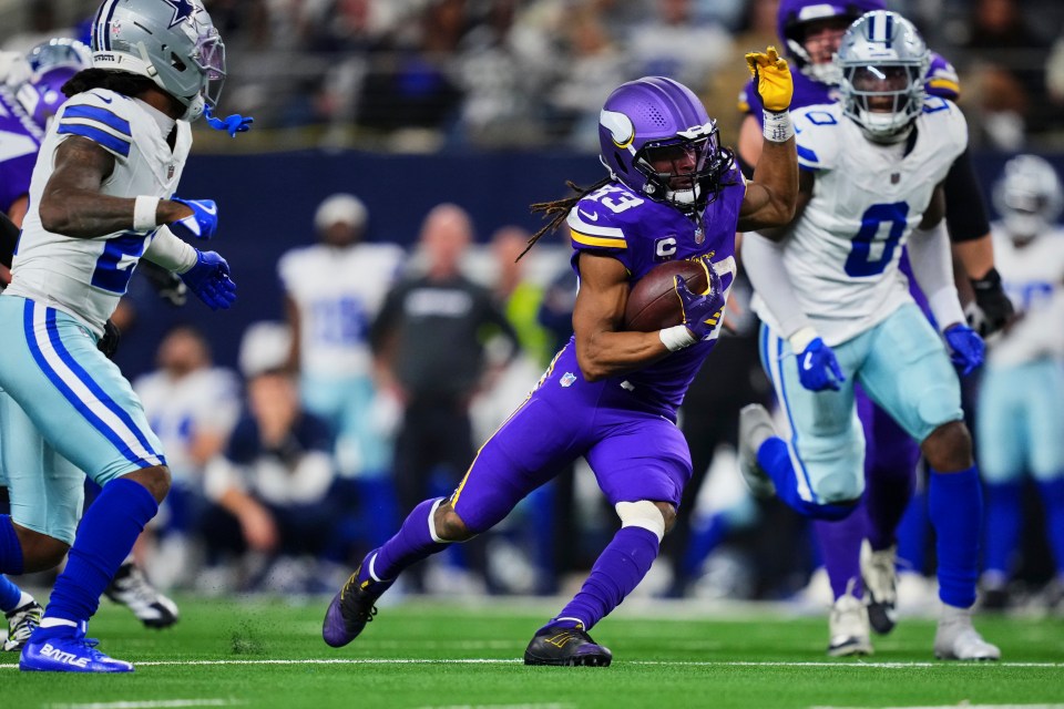Aaron Jones Sr. #33 of the Minnesota Vikings carries the ball against the Dallas Cowboys during the second half of an NFL football game at AT&T Stadium on December 14, 2025 in Arlington, Texas.
