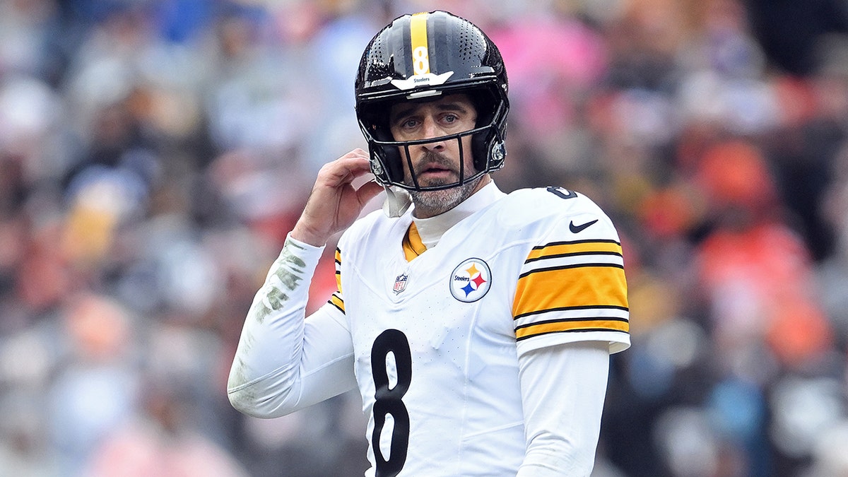 Aaron Rodgers looks on field