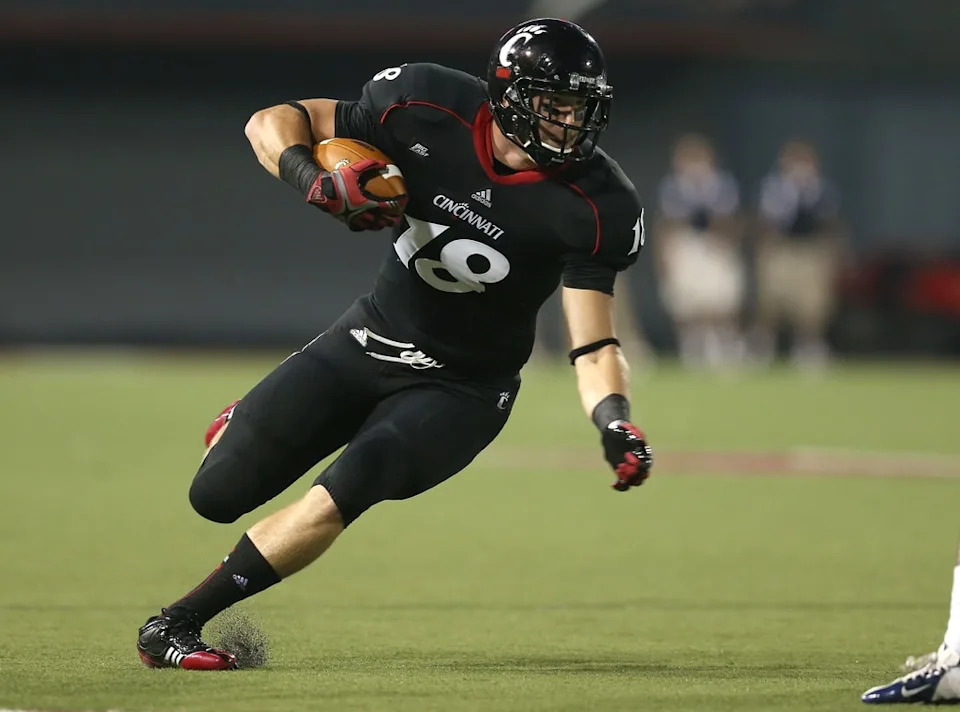 <p>3. Travis played hockey, baseball and basketball before getting into football, and he was a quarterback in high school. In fact, he was a two-star QB recruit for Cincinnati, and only ended up switching to tight end as a condition of his reinstatement to the team after his suspension.</p> <p>"We had an awesome quarterback at the time in <strong>Zach Collaros</strong> and we needed some help in the run game as well as the passing game," Travis told <a href="https://www.arrowheadpride.com/2013/4/27/4273998/chiefs-draft-picks-2013-travis-kelce" rel="nofollow noopener" target="_blank" data-ylk="slk:Arrowhead Pride;elm:context_link;itc:0;sec:content-canvas" class="link ">Arrowhead Pride</a> after he was drafted by the Chiefs in 2013, "so I talked to coach <strong>Butch Jones</strong>, who was my coach at the time, and he said we need a tight end and my skill-set, athleticism and my direction all transferred over and it worked out perfect for me."</p> <p>Or, as he <a href="https://www.gq.com/story/travis-kelce-kansas-city-chiefs-profile" rel="nofollow noopener" target="_blank" data-ylk="slk:put it to GQ;elm:context_link;itc:0;sec:content-canvas" class="link ">put it to <em>GQ</em></a> in 2017 while rehashing his un-shining moment, "Everybody my entire life had been telling me I was a tight end anyway."</p>