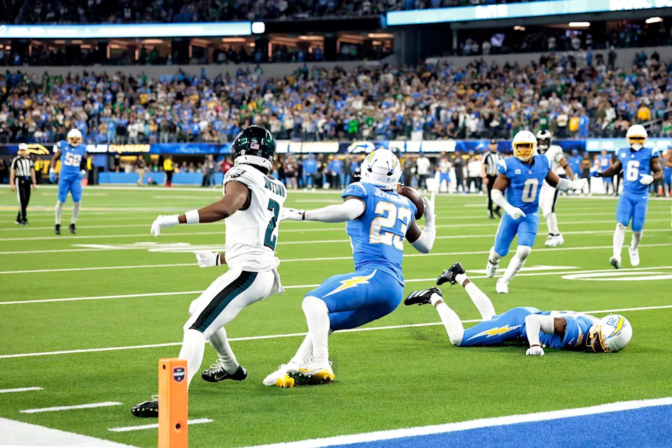 INGLEWOOD, CALIFORNIA - DECEMBER 08: Tony Jefferson #23 of the Los Angeles Chargers intercepts a pass intended for Jahan Dotson #2 of the Philadelphia Eagles during overtime at SoFi Stadium on December 08, 2025 in Inglewood, California. The Los Angeles Chargers beat the Philadelphia Eagles 22-19. (Photo by Ronald Martinez/Getty Images)
