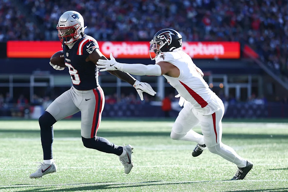 FOXBOROUGH, MASSACHUSETTS - NOVEMBER 02: Stefon Diggs #8 of the New England Patriots evades a tackle from Jessie Bates III #3 of the Atlanta Falcons during the NFL 2025 game between Atlanta Falcons and New England Patriots at Gillette Stadium on November 02, 2025 in Foxborough, Massachusetts. (Photo by Maddie Meyer/Getty Images)