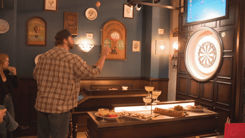 A Cincinnati Bengals player is helping a new bar get ready for its grand opening. Ted Karras threw the inaugural dart for Flight Club Cincinnati at Fountain Square on Tuesday. (WKRC)