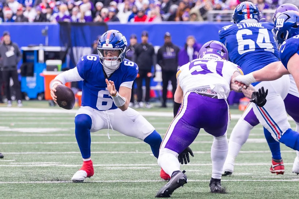 Jaxson Dart of the New York Giants is forced out of the pocket by linebacker Blake Cashman of the Minnesota Vikings during the first half at MetLife Stadium on Dec. 21, 2025. Corey Sipkin for the NY POST
