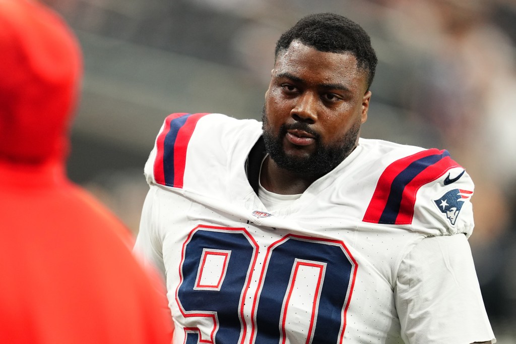 Christian Barmore #90 of the New England Patriots looks on during warmups before a game against the Las Vegas Raiders at Allegiant Stadium on October 15, 2023 in Las Vegas, Nevada. 