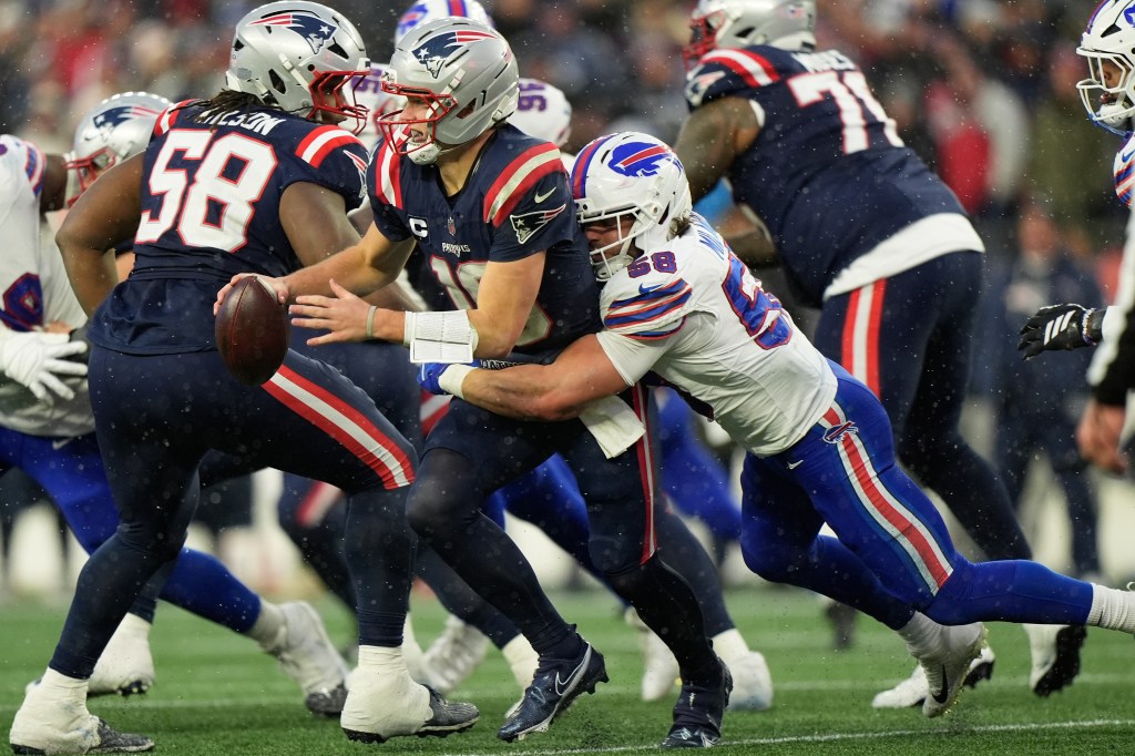 Buffalo Bills linebacker Matt Milano sacks New England Patriots quarterback Drake Maye.