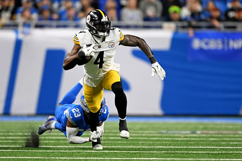 Dec 21, 2025; Detroit, Michigan, USA; Detroit Lions cornerback Rock Ya-Sin (23) tackles Pittsburgh Steelers wide receiver DK Metcalf (4) during the fourth quarter at Ford Field. Mandatory Credit: Lon Horwedel-Imagn ImagesLon Horwedel-Imagn Images