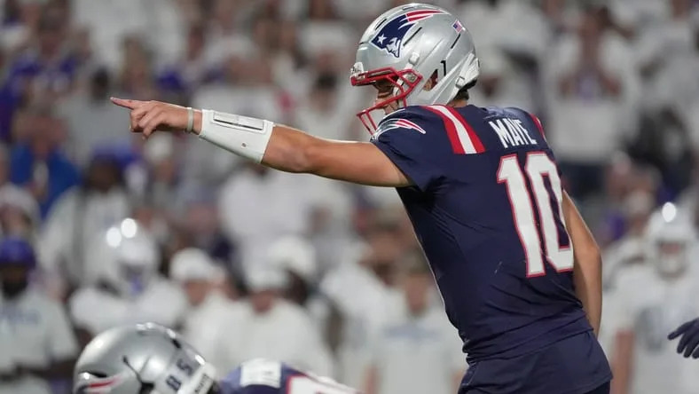 New England Patriots quarterback Drake Maye lets the offense line know what he sees during first half action at Highmark Stadium in Orchard Park on Oct. 5, 2025.