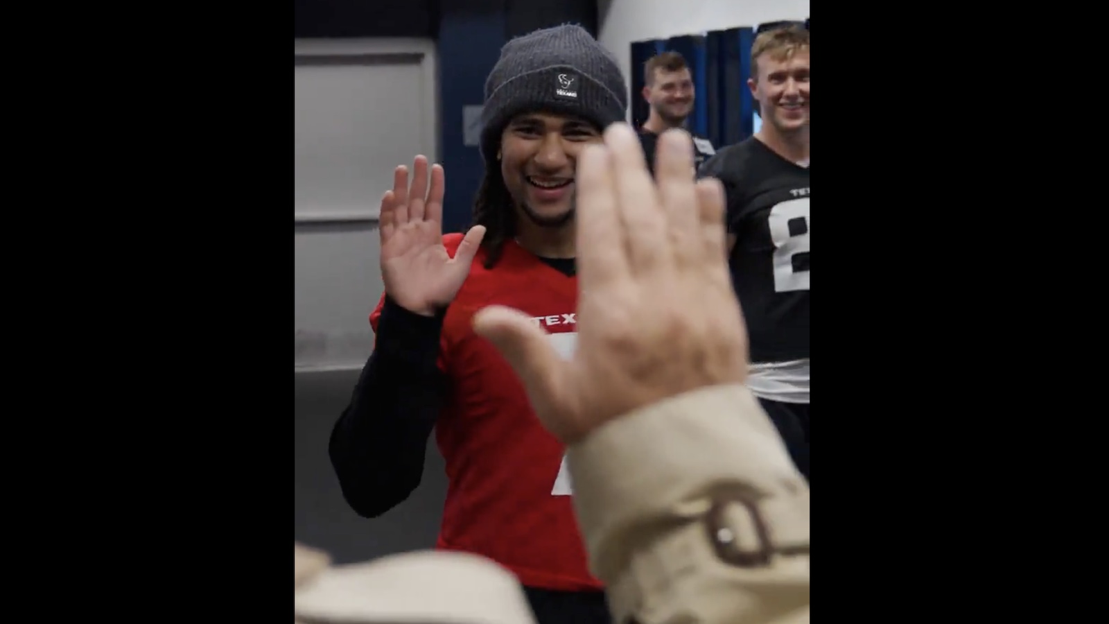 CJ Stroud giving a high five to Texans owner Cal McNair