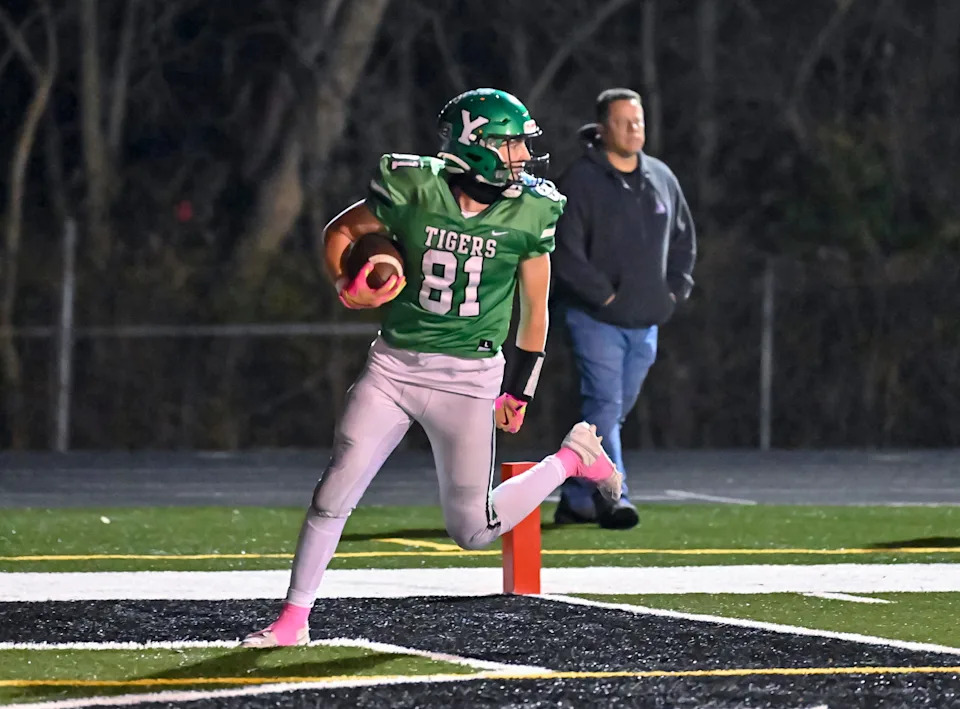 Yorktown senior Cole Perdue scores a touchdown during an IHSAA Class 4A football regional championship game against Roncalli Friday, Nov. 14, 2025, at Yorktown High School.