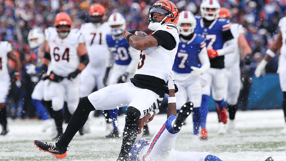 Tee Higgins #5 of the Cincinnati Bengals is tackled by Maxwell Hairston #31 of the Buffalo Bills during the fourth quarter at Highmark Stadium on December 07, 2025 in Orchard Park, New York. (Photo by Jamie Schwaberow/Getty Images)