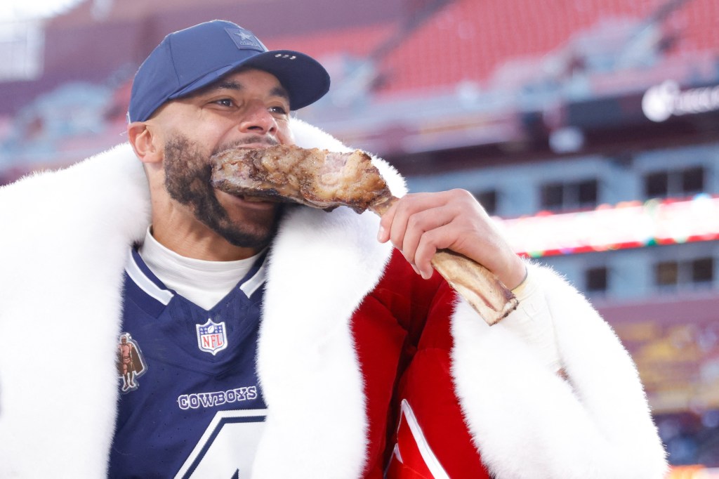 Dallas Cowboys quarterback Dak Prescott eating a steak after the game.