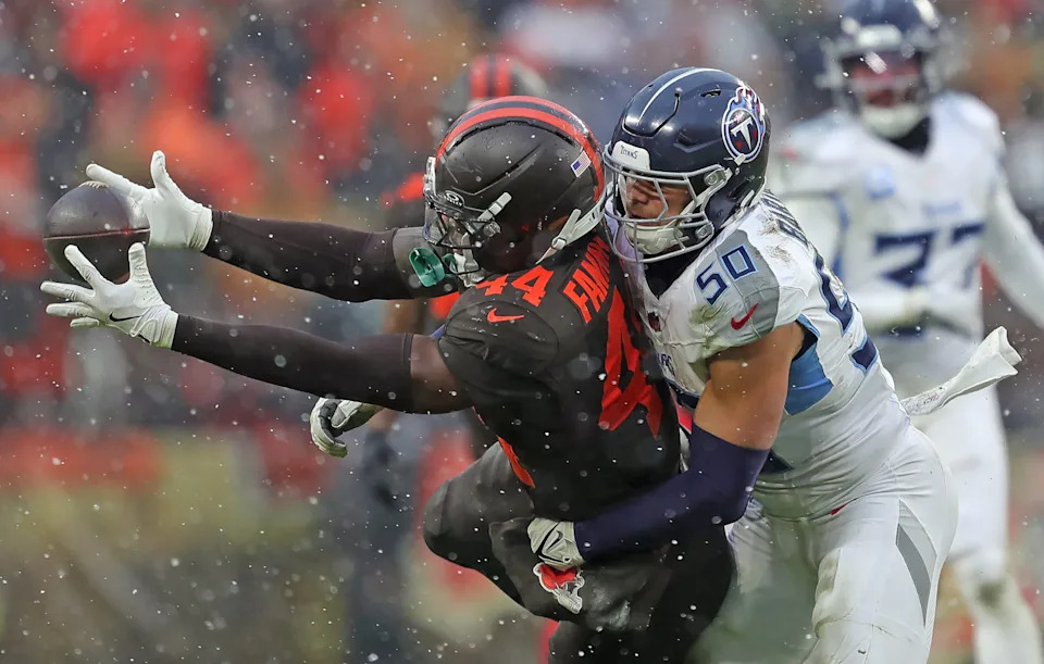 Cleveland Browns tight end Harold Fannin Jr. (44) bobbles a pass against Tennessee Titans linebacker Cody Barton (50) during the second half of an NFL football game at Huntington Bank Field, Dec. 7, 2025, in Cleveland, Ohio.