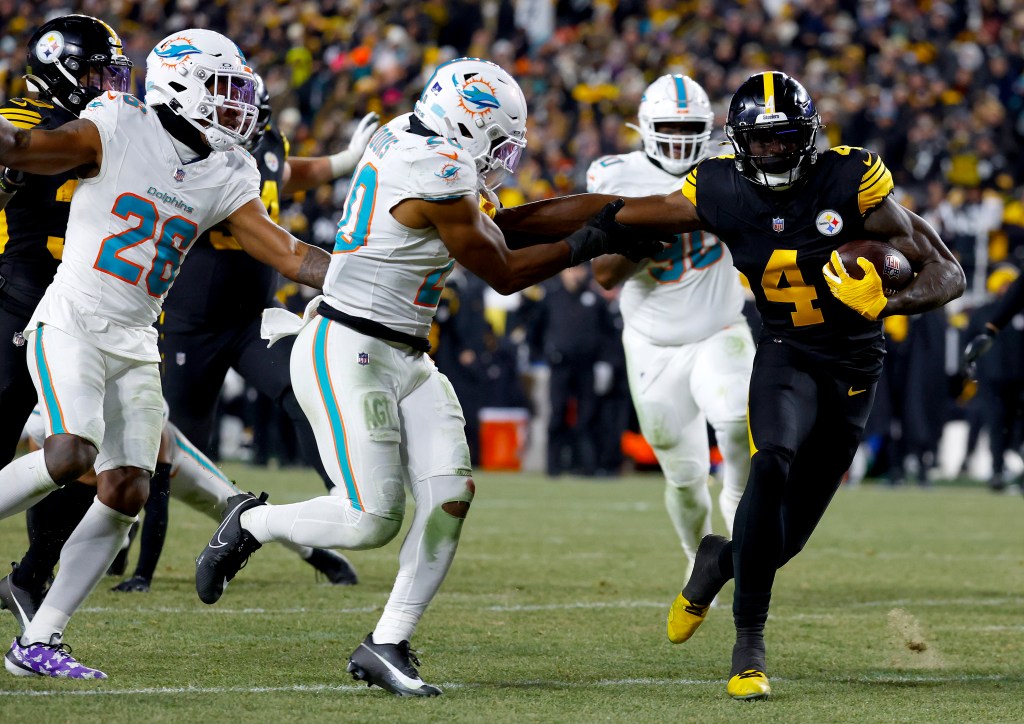 DK Metcalf #4 of the Pittsburgh Steelers scores a touchdown during the third quarter of the game against the Miami Dolphins at Acrisure Stadium on December 15, 2025 in Pittsburgh, Pennsylvania.