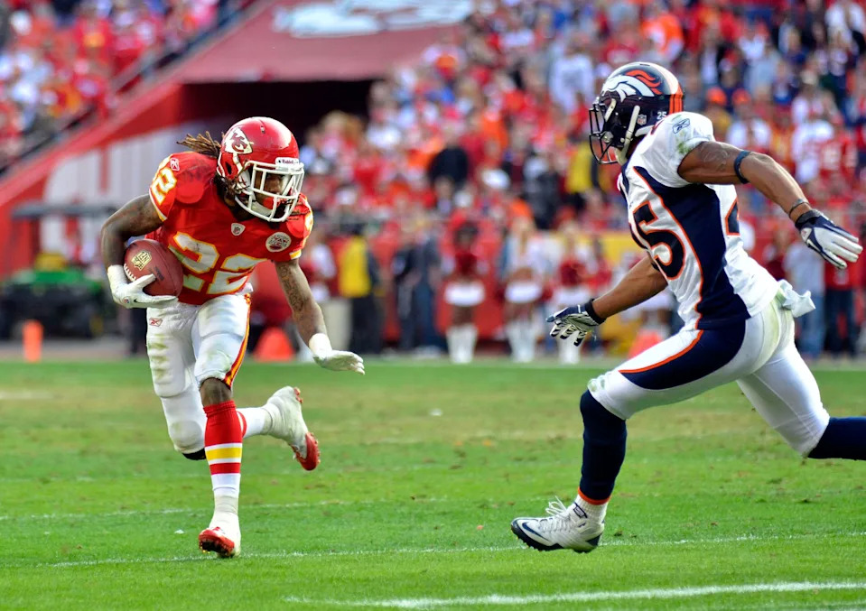 Nov 13, 2011; Kansas City, MO, USA; Kansas City Chiefs running back Dexter McCluster (22) runs for yardage as Denver Broncos strong safety Chris Harris (25) attempts the tackle in the fourth quarter at Arrowhead Stadium. The Broncos won 17-10. Mandatory Credit: Denny Medley-USA TODAY Sports