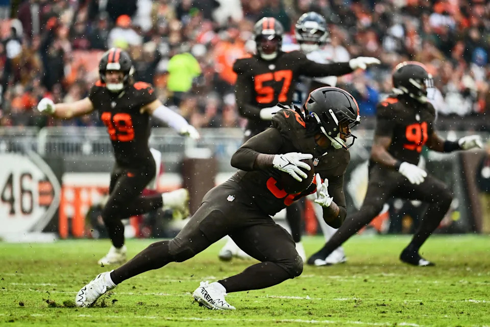 Dec 7, 2025; Cleveland, Ohio, USA; Cleveland Browns linebacker Devin Bush (30) intercepts a pass thrown by Tennessee Titans quarterback Cam Ward (not pictured) during the first quarter at Huntington Bank Field. Mandatory Credit: Ken Blaze-Imagn Images