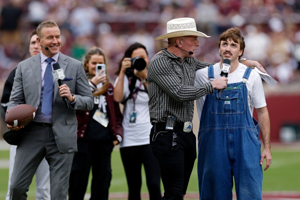 ESPN College GameDay analysts Pat McAfee and Kirk Herbstreit with Austin Roberts prior to the $1.5 million field goal challenge before the 2025 College Football Playoff First Round Game between the Miami Hurricanes and Texas A&M Aggies on December 20, 2025 at Kyle Field