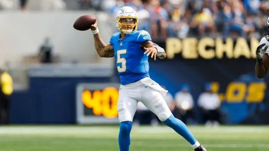 Trey Lance #5 of the Los Angeles Chargers throws on the run during the second half against the New Orleans Saints at SoFi Stadium on August 10, 2025 in Inglewood, California. 