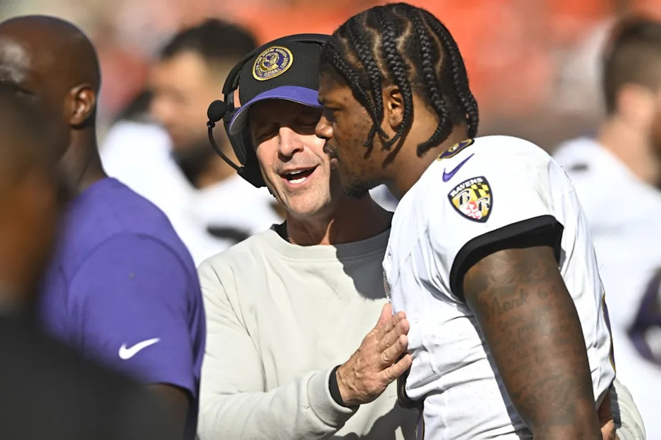 Oct 1, 2023; Cleveland, Ohio, USA; Baltimore Ravens head coach John Harbaugh talks with quarterback Lamar Jackson (8) in the fourth quarter against the Cleveland Browns at Cleveland Browns Stadium.