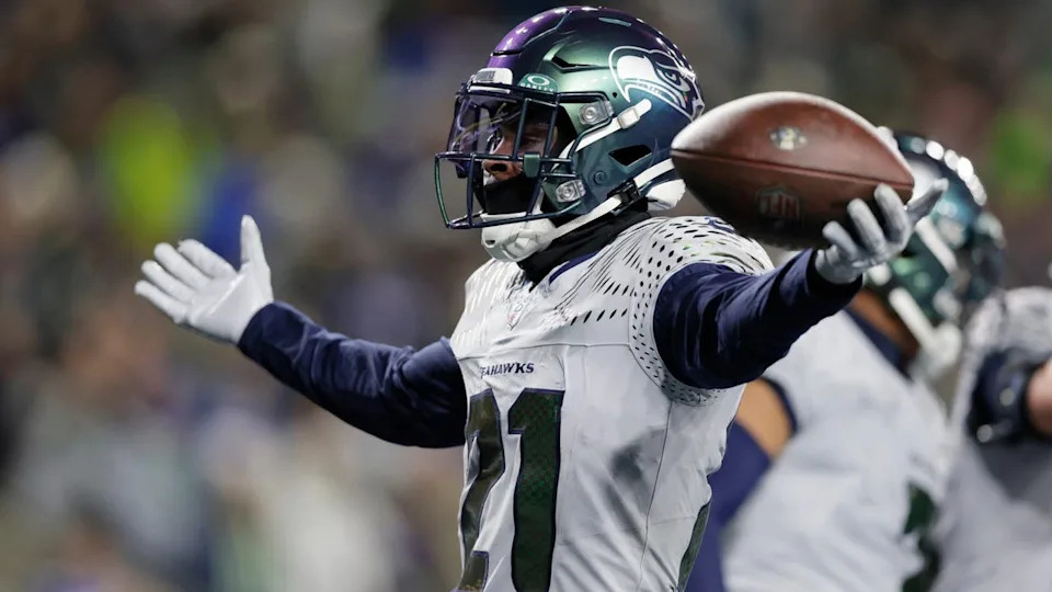 <div>Seattle Seahawks cornerback Devon Witherspoon (21) celebrates while holding the ball after a play against the Los Angeles Rams in an NFL football game, Thursday, Dec. 18, 2025, in Seattle. (AP Photo/John Froschauer)</div>