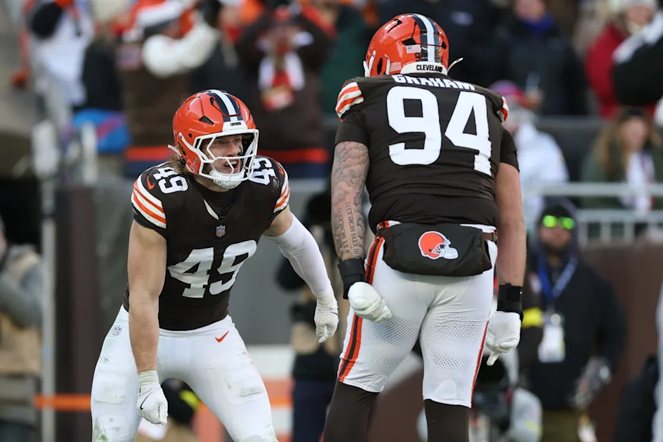 Dec 21, 2025; Cleveland, Ohio, USA; Cleveland Browns linebacker Carson Schwesinger (49) reacts with defensive tackle Mason Graham (94) after a sack against the Buffalo Bills during the second half at Huntington Bank Field. Mandatory Credit: Scott Galvin-Imagn Images