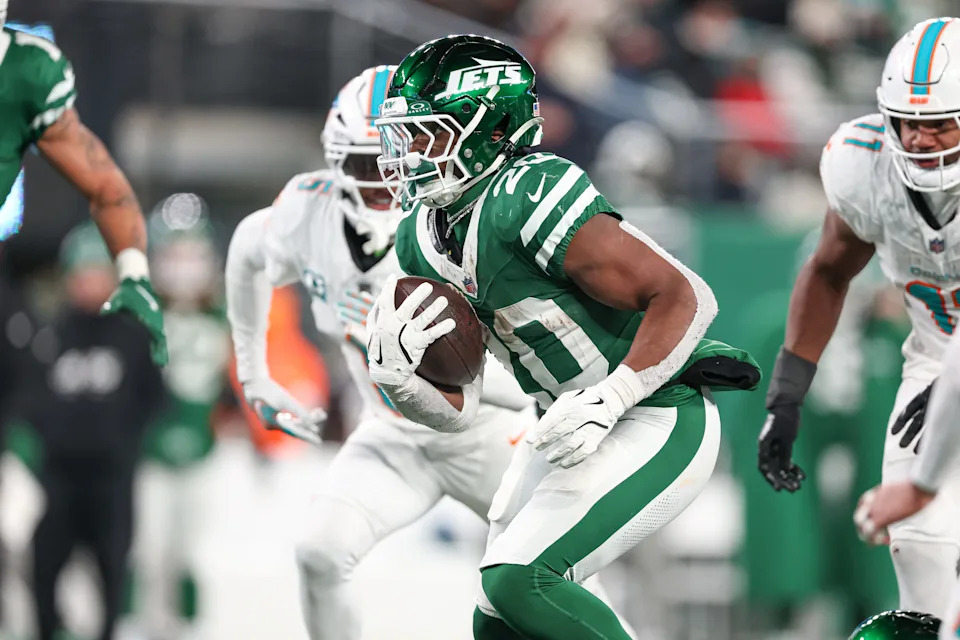 Jan 5, 2025; East Rutherford, New Jersey, USA; New York Jets running back Breece Hall (20) carries the ball during the second half against the Miami Dolphins at MetLife Stadium. Mandatory Credit: Vincent Carchietta-Imagn Images